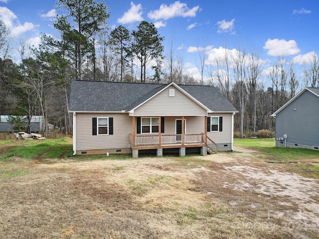 view of front of home with a porch and a front yard