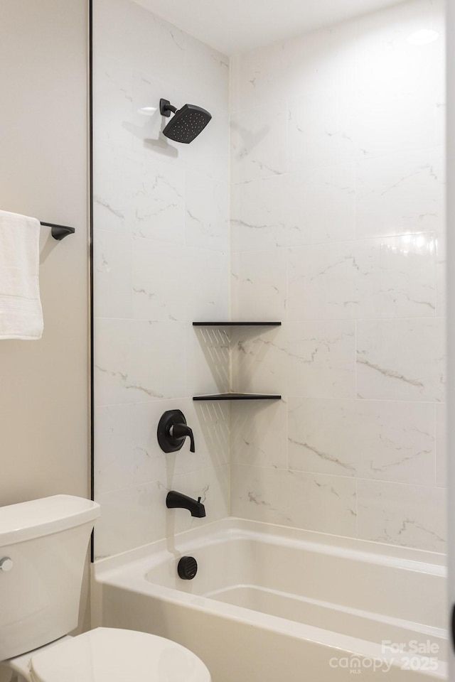 full bathroom featuring washtub / shower combination and toilet