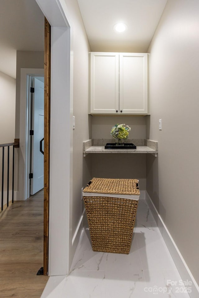 interior space featuring recessed lighting and baseboards