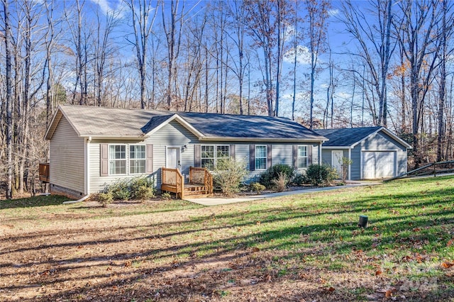 single story home featuring a front lawn and a garage