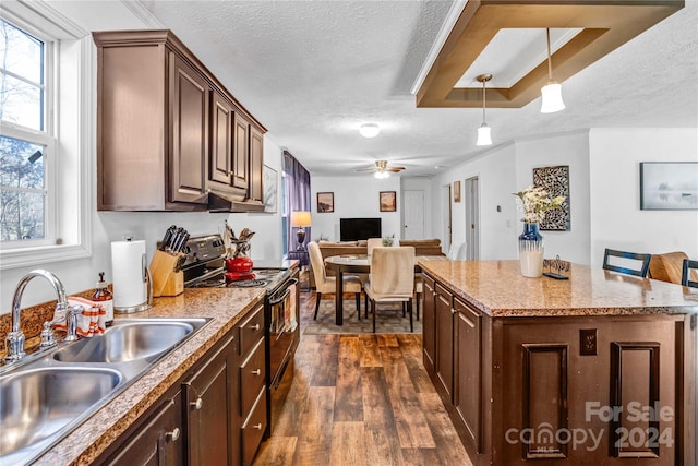 kitchen with a wealth of natural light, sink, black electric range oven, and dark hardwood / wood-style floors