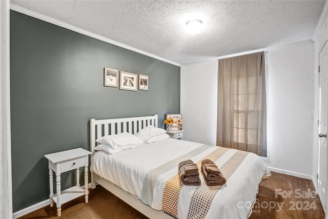 carpeted bedroom featuring crown molding and a textured ceiling