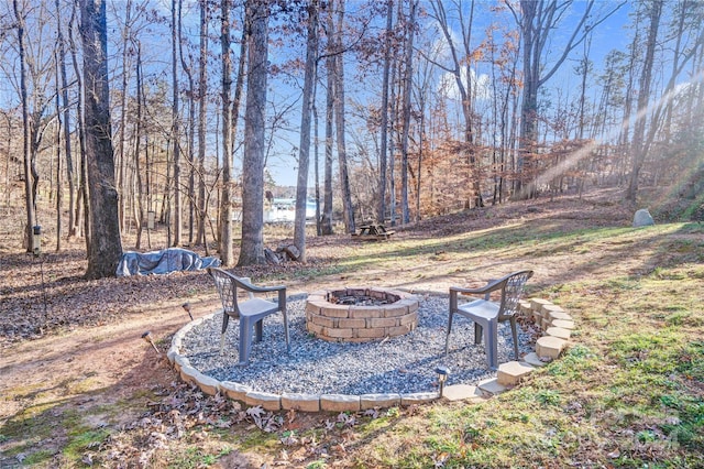 view of yard with a fire pit