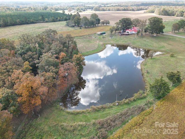 drone / aerial view with a rural view and a water view