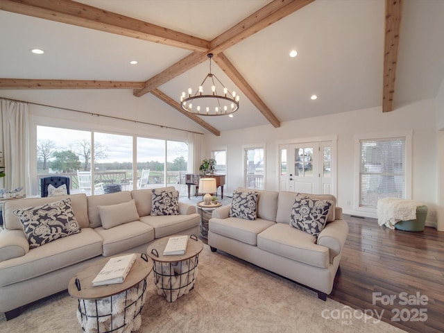 living room featuring a chandelier, vaulted ceiling with beams, and hardwood / wood-style flooring