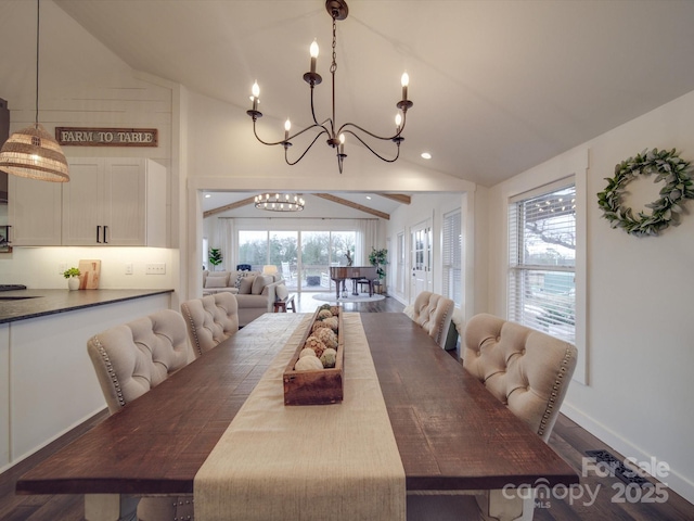 dining area with vaulted ceiling with beams, a chandelier, and hardwood / wood-style flooring