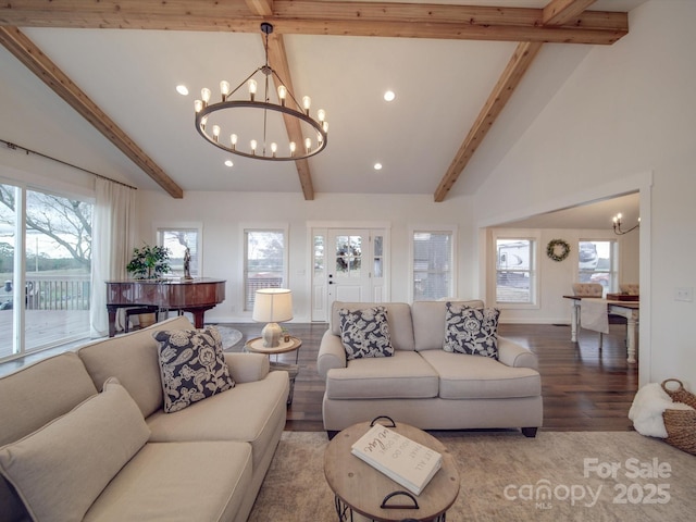 living room with beam ceiling, hardwood / wood-style floors, high vaulted ceiling, and a chandelier