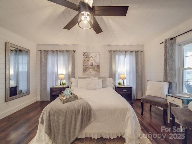 bedroom featuring ceiling fan and dark wood-type flooring