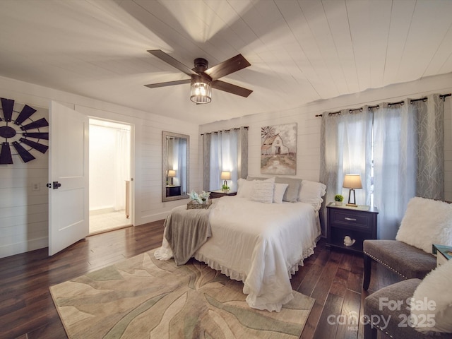 bedroom featuring ceiling fan and dark wood-type flooring