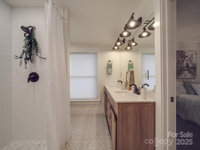 bathroom with tile patterned flooring, vanity, and a shower with shower curtain