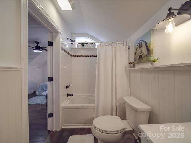 full bathroom with lofted ceiling, hardwood / wood-style flooring, ceiling fan, toilet, and shower / bathtub combination with curtain