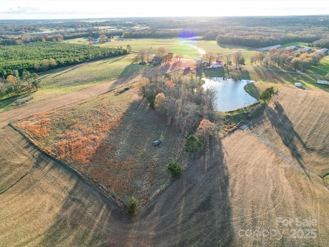 drone / aerial view featuring a rural view and a water view