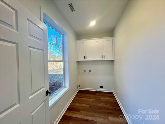 laundry area featuring hookup for a washing machine, cabinets, and dark hardwood / wood-style floors