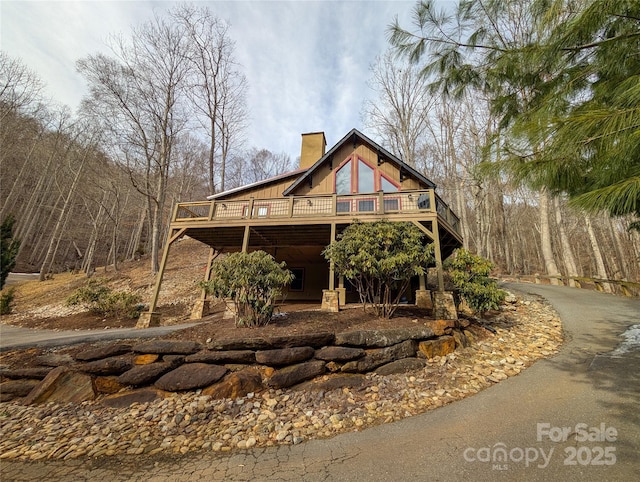 view of front of property with a wooden deck