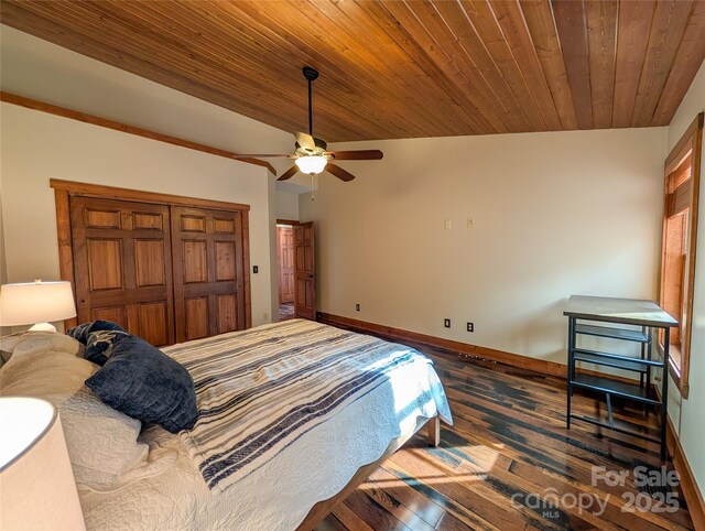 bedroom featuring dark wood-style flooring, lofted ceiling, wood ceiling, ceiling fan, and baseboards