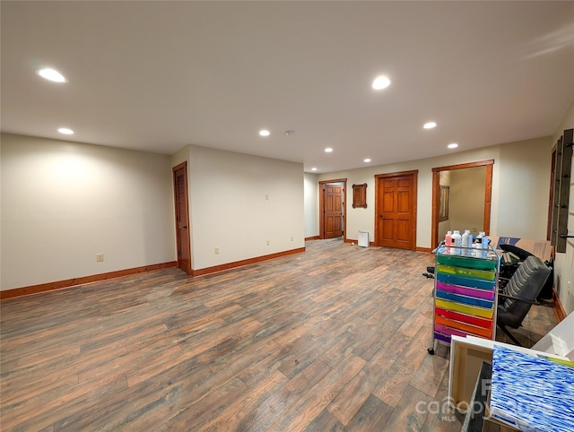 below grade area with baseboards, wood finished floors, and recessed lighting