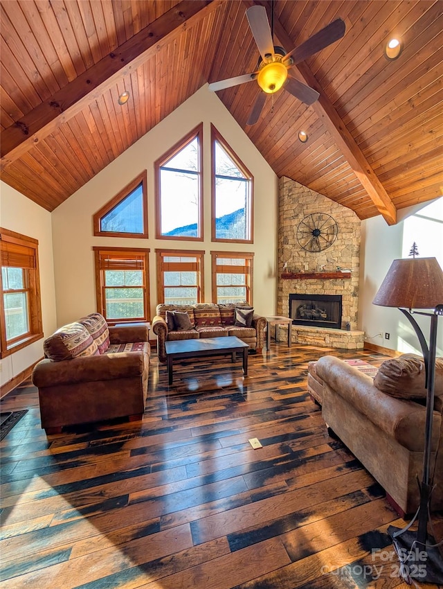 living area featuring high vaulted ceiling, beam ceiling, a fireplace, and hardwood / wood-style floors