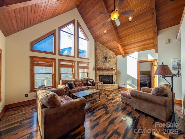 living room featuring wood ceiling, wood-type flooring, baseboards, and a stone fireplace