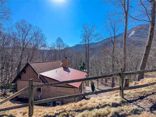 mountain view featuring a forest view