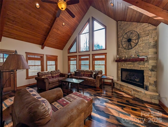living area with wooden ceiling, a fireplace, a ceiling fan, and hardwood / wood-style flooring