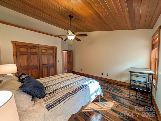 bedroom with baseboards, a ceiling fan, wood ceiling, and dark wood-type flooring