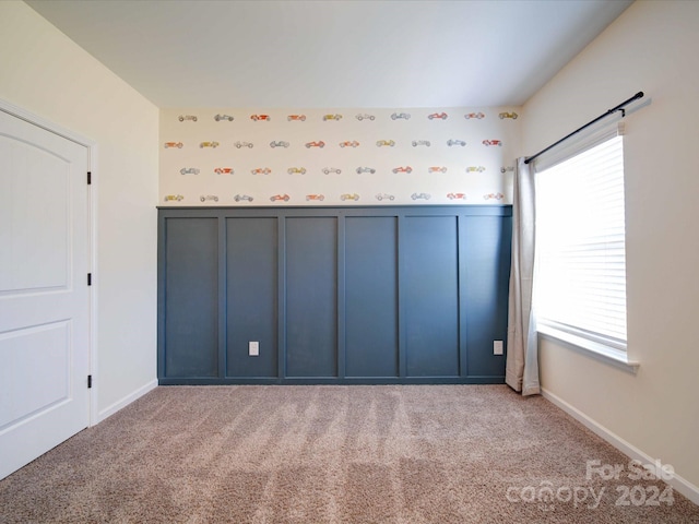 unfurnished bedroom featuring light colored carpet