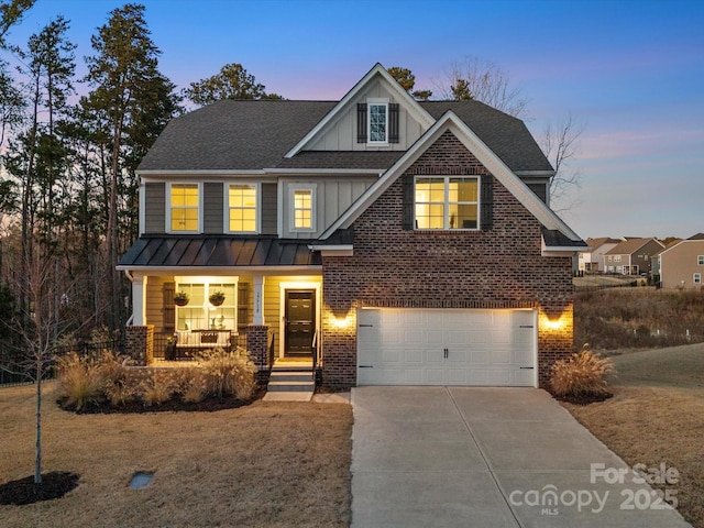 craftsman-style house featuring covered porch and a garage