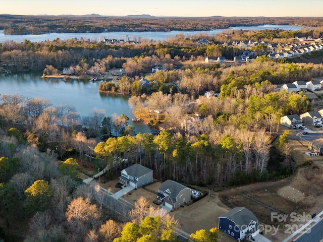 aerial view at dusk with a water view