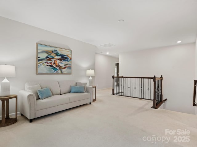 living room with light colored carpet