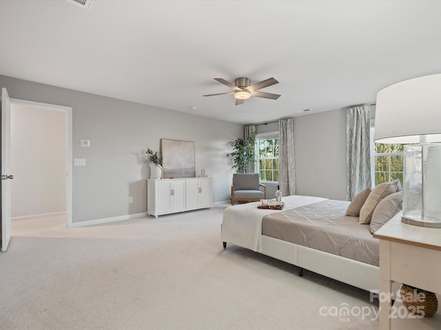 bedroom featuring ceiling fan and light colored carpet