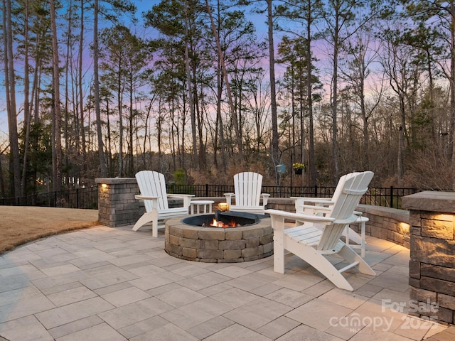 patio terrace at dusk with an outdoor fire pit