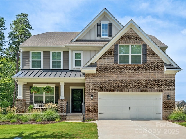 craftsman-style house featuring a porch, a front yard, and a garage