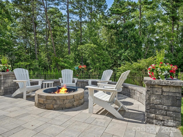 view of patio / terrace featuring a fire pit