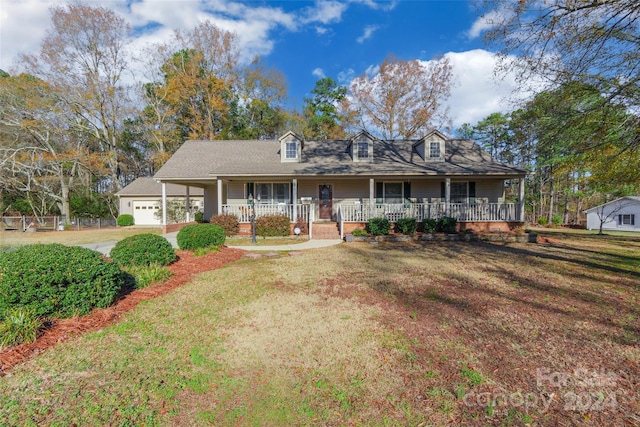 view of front facade featuring a porch, a garage, and a front lawn