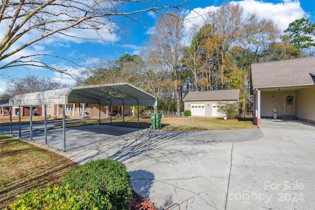 exterior space with a garage and a carport