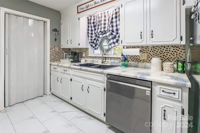 kitchen featuring decorative backsplash, black dishwasher, white cabinets, and sink