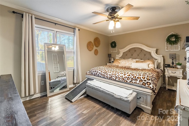 bedroom with ceiling fan, dark hardwood / wood-style floors, and ornamental molding