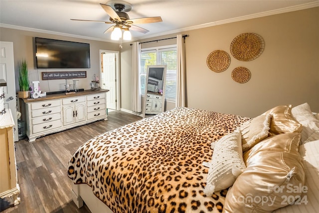 bedroom featuring ceiling fan, dark wood-type flooring, and ornamental molding