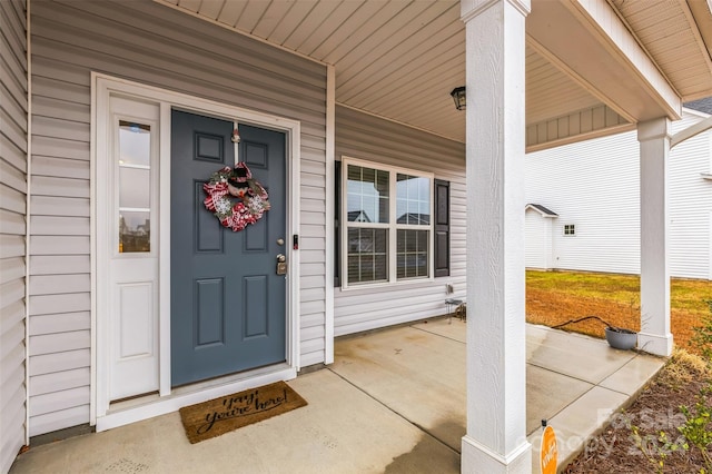 entrance to property featuring a porch