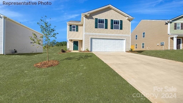 view of front property with a garage and a front lawn