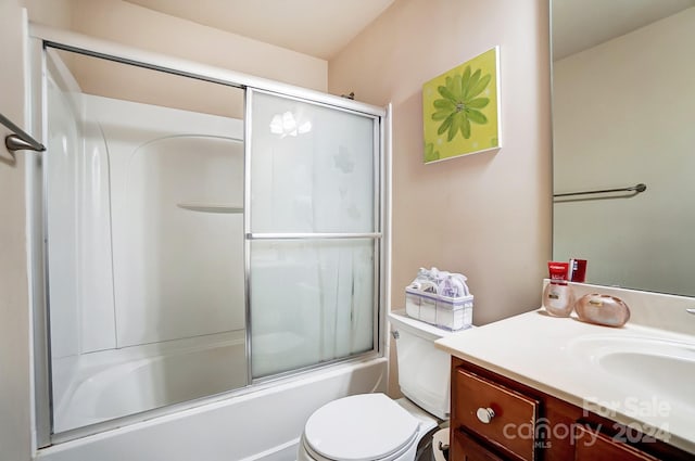 full bathroom featuring shower / bath combination with glass door, vanity, and toilet