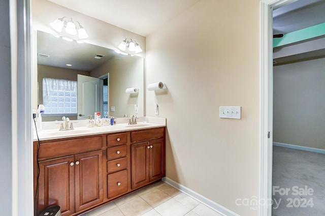 bathroom featuring tile patterned flooring and vanity