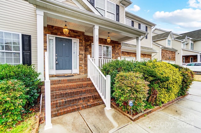 property entrance with covered porch