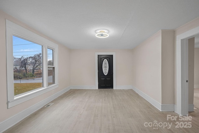 entrance foyer featuring a textured ceiling