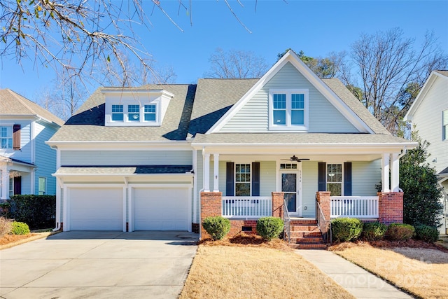 view of front of property featuring covered porch and a garage