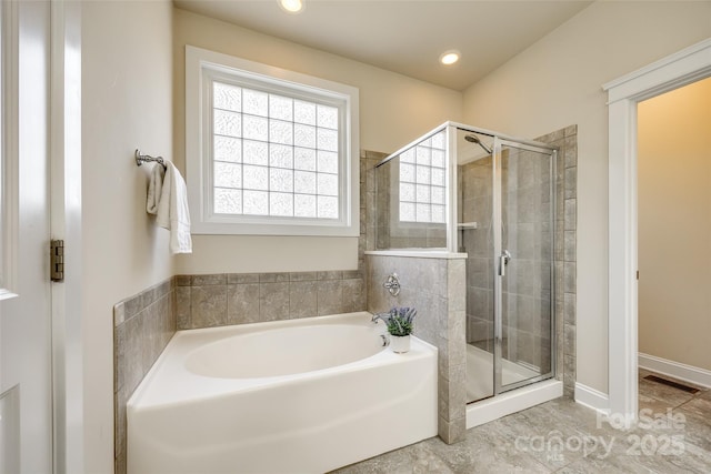 bathroom with plus walk in shower and tile patterned flooring