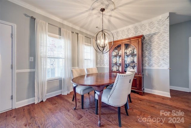 dining space featuring a chandelier, crown molding, and wood-type flooring