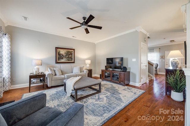 living room with ceiling fan, dark hardwood / wood-style flooring, and crown molding