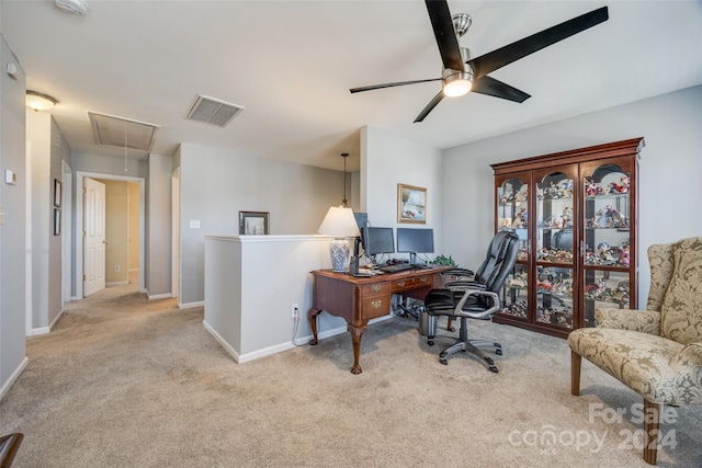 carpeted office with ceiling fan