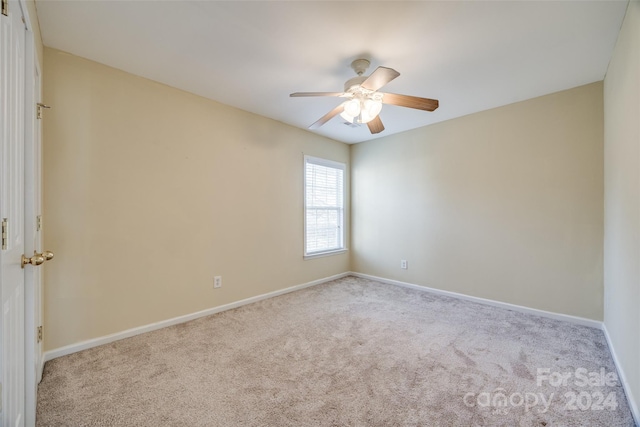 carpeted empty room with ceiling fan